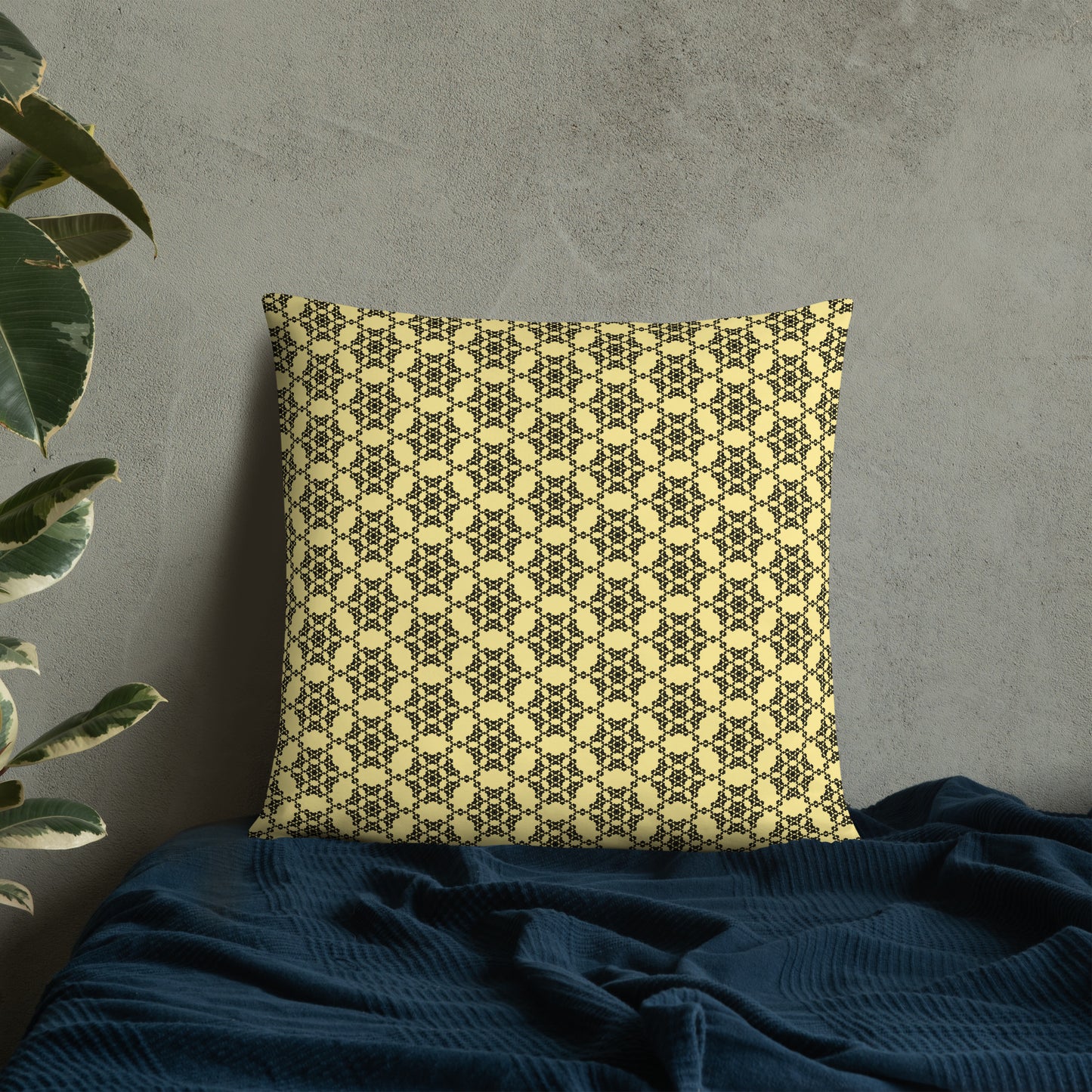 22″×22″ throw pillow with the 'Hexagon' yellow and black geometric pattern on a bed.