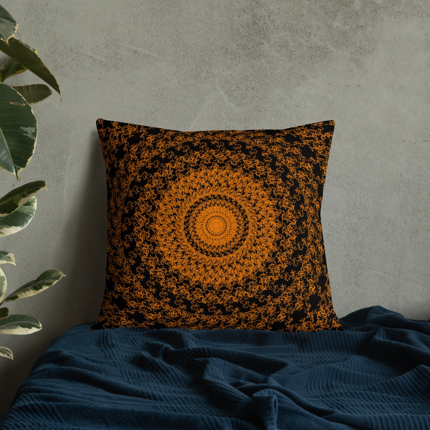 22″×22″ premium throw pillow with the 'The Sun' orange and black geometric design on a bed.