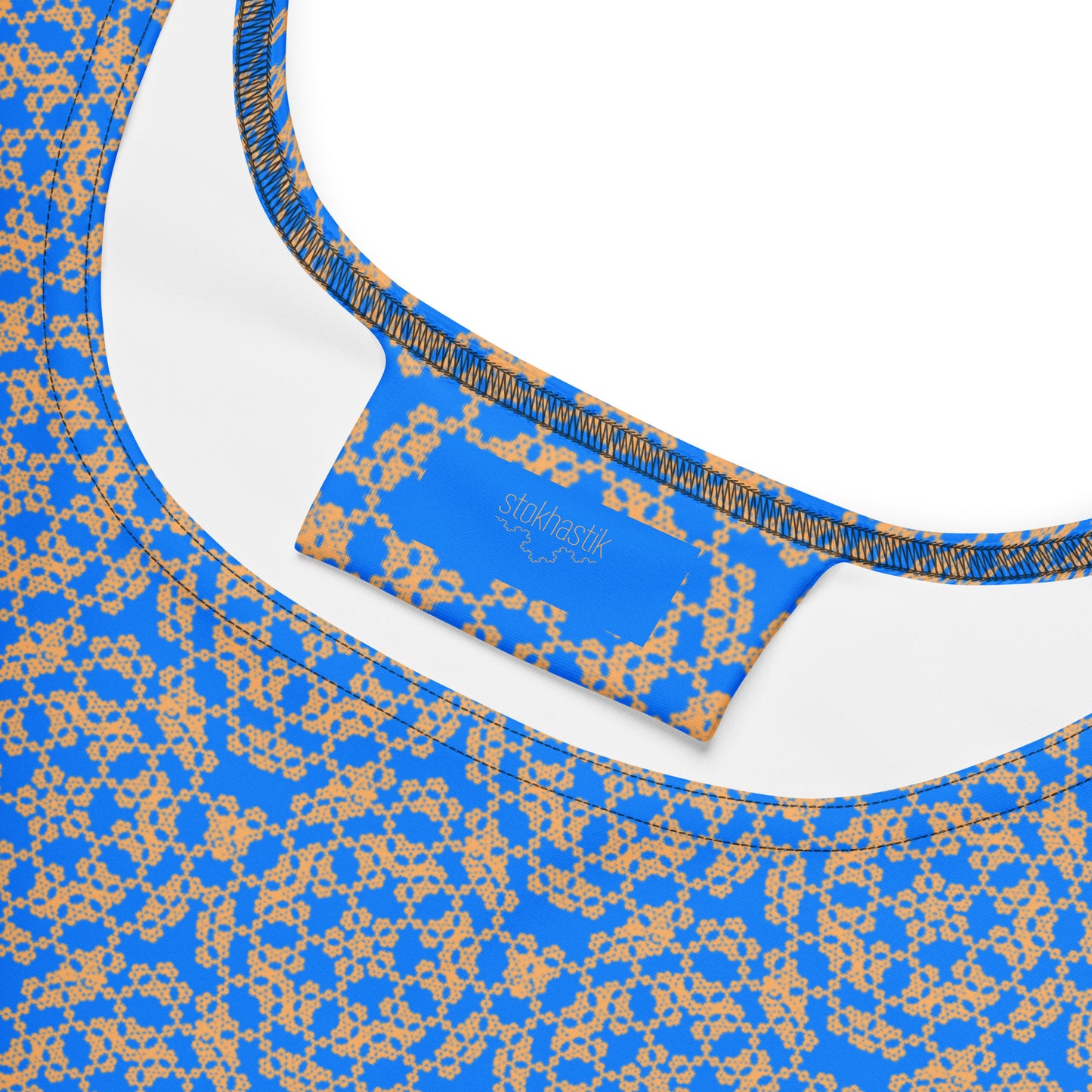 Inside label of the skater dress with the 'Pentagon' blue and yellow fractal geometric pattern.