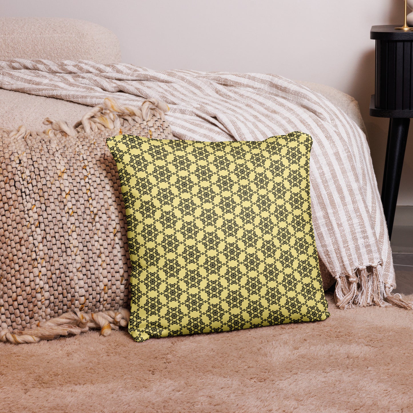 18″×18″ throw pillow with the 'Hexagon' yellow and black geometric pattern on a couch.