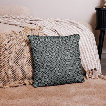 18″×18″ throw pillow with the 'Tetragon' charcoal and white geometric pattern on a couch.