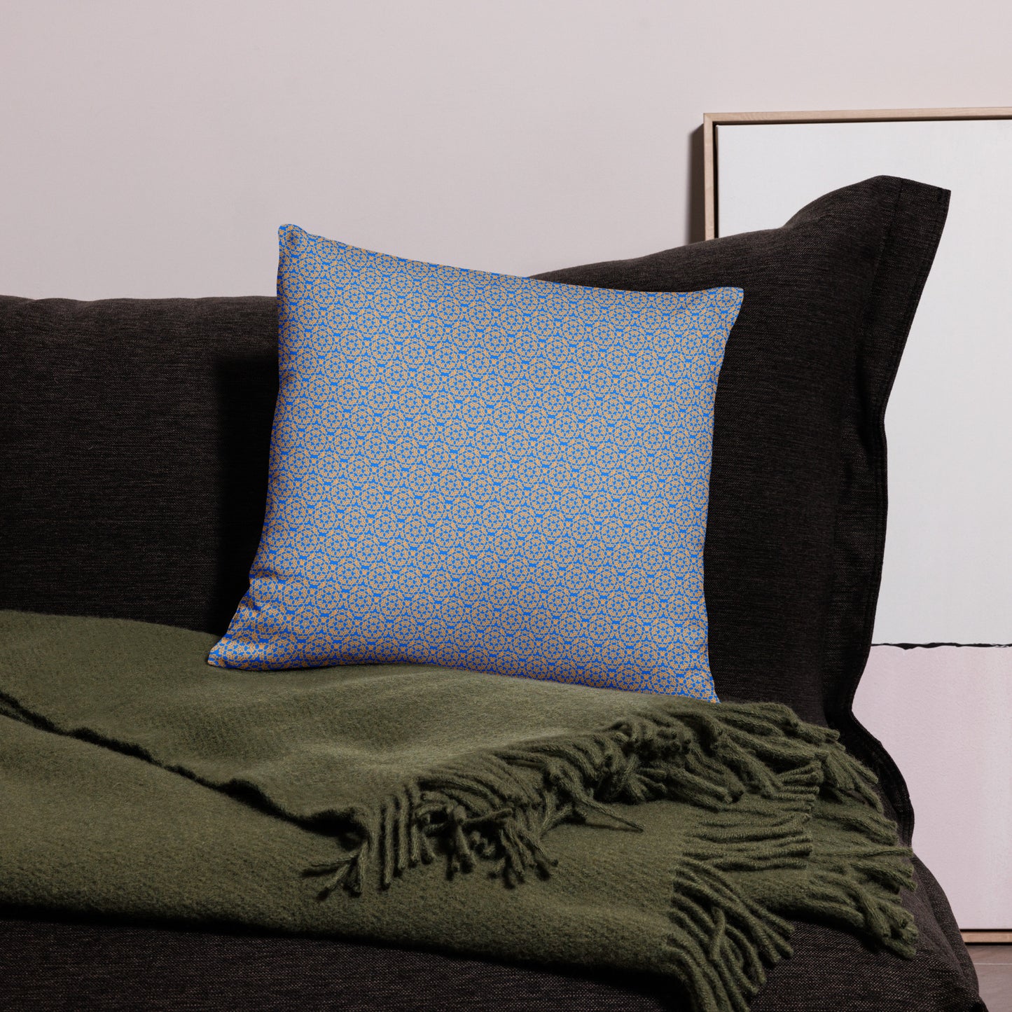 18″×18″ throw pillow with the 'Pentagon' blue and yellow geometric pattern on a couch.