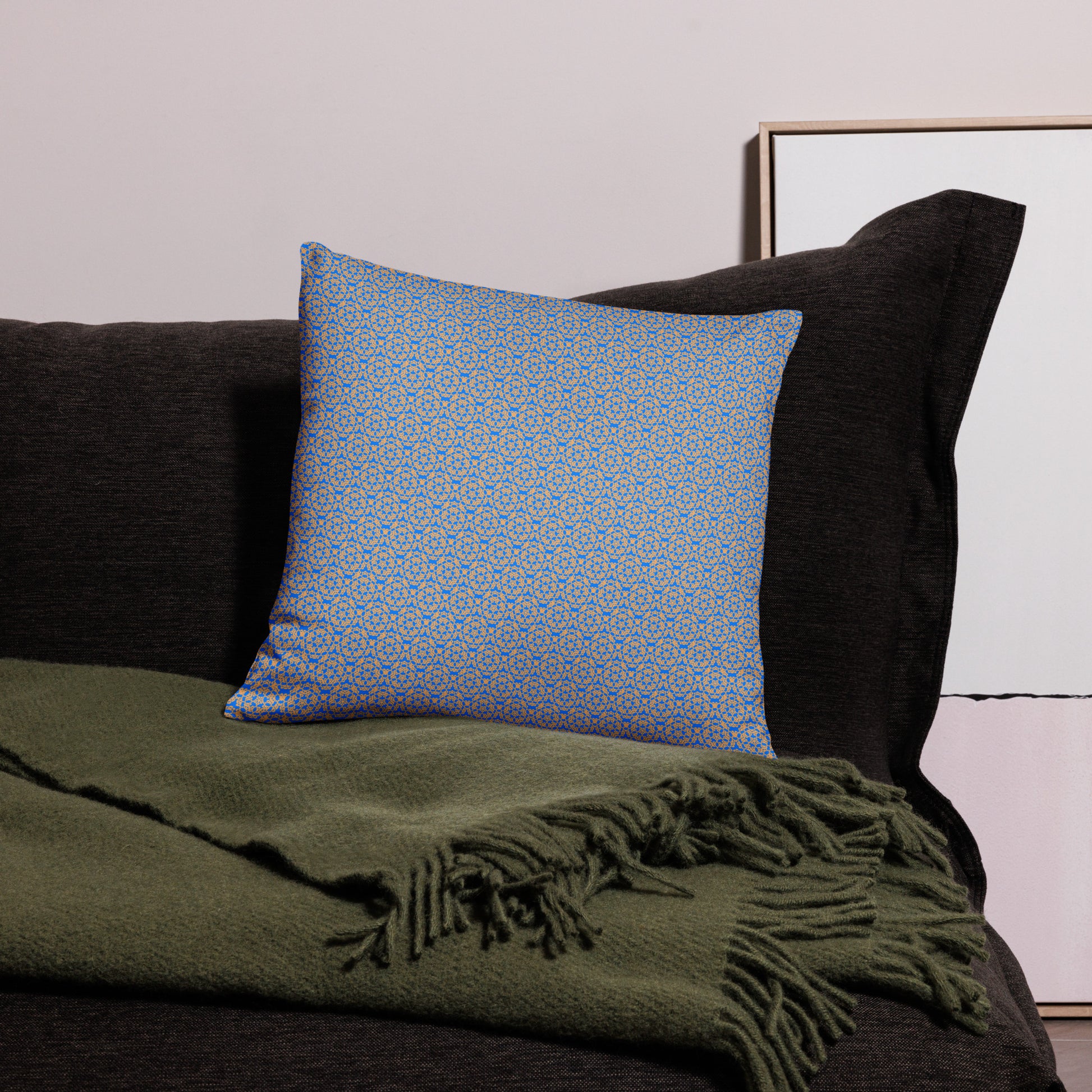 18″×18″ throw pillow with the 'Pentagon' blue and yellow geometric pattern on a couch.
