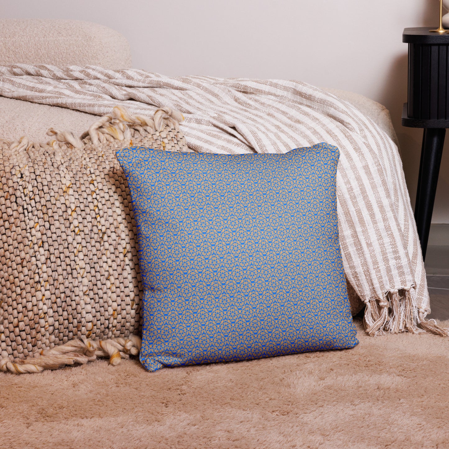 18″×18″ throw pillow with the 'Pentagon' blue and yellow geometric pattern on a couch.