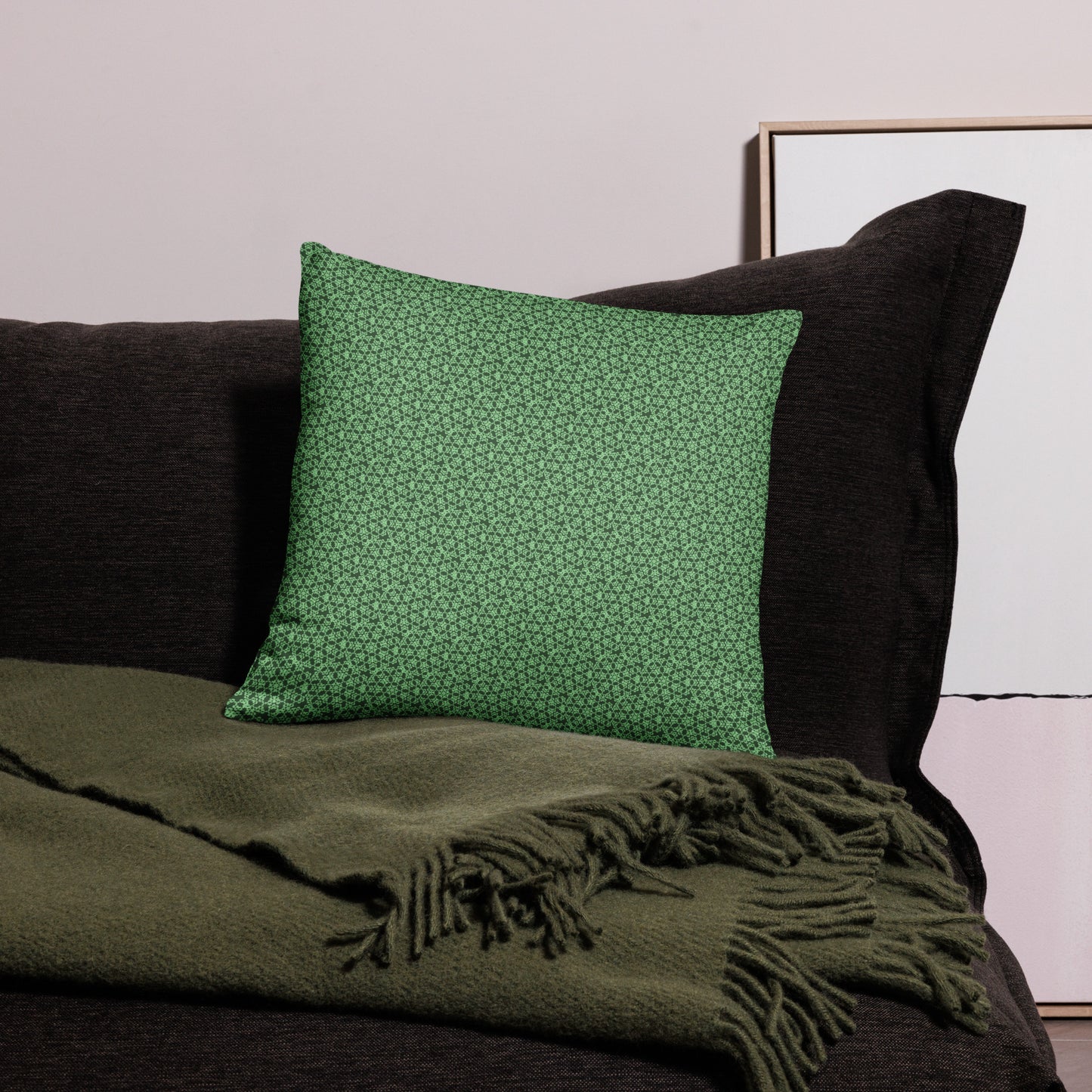 18″×18″ throw pillow with the 'Heptagon' green geometric pattern on a couch.