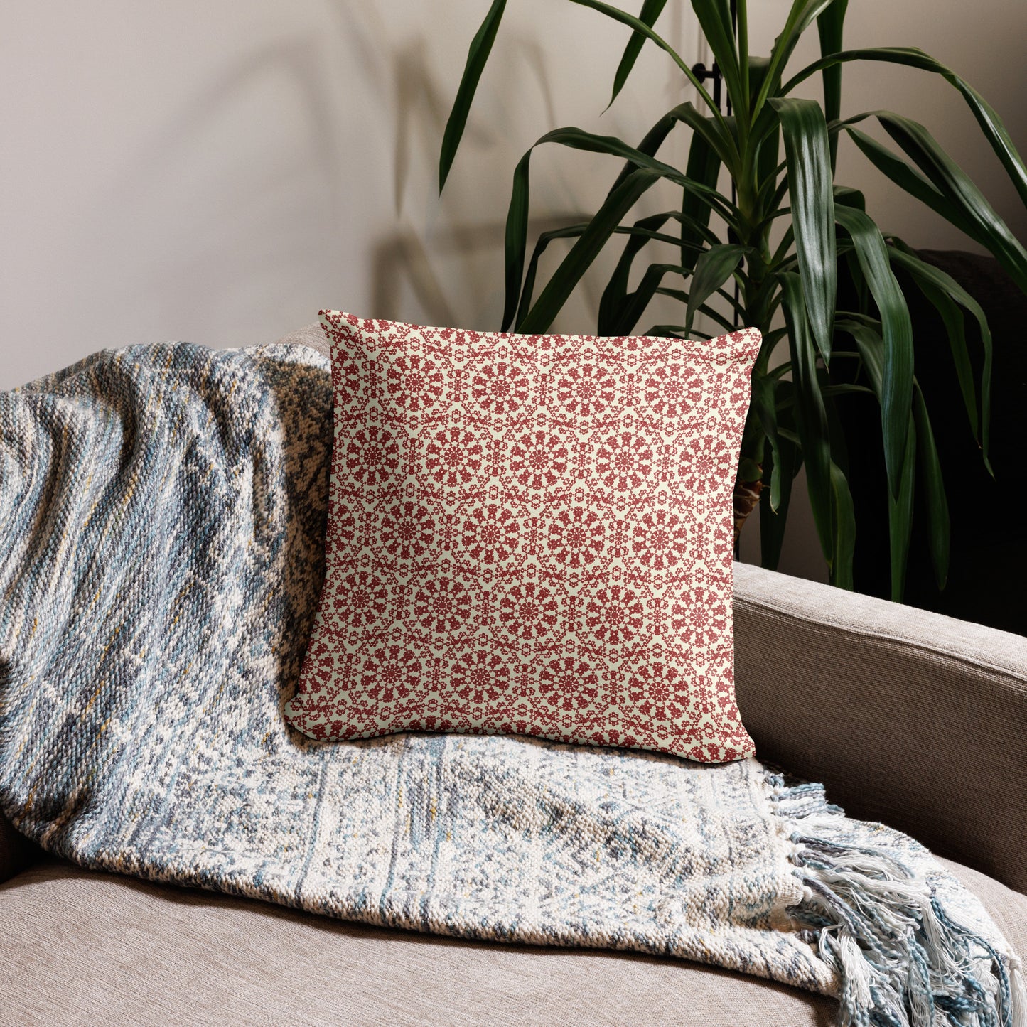 18″×18″ throw pillow with the ‘Decagon’ terracotta and beige geometric pattern on a beige sofa with a woven throw.