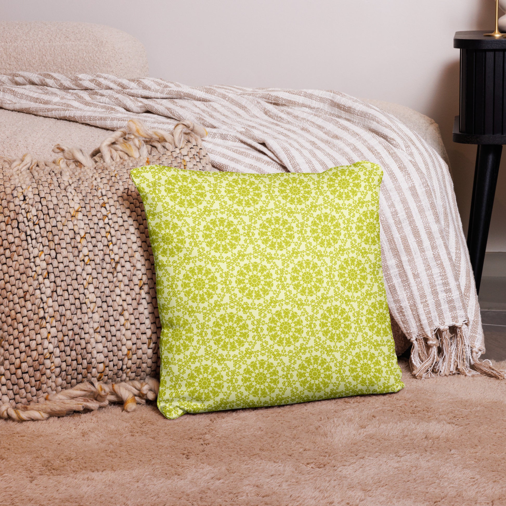 18″×18″ throw pillow with the 'Hendecagon' yellow-green geometric pattern in a cozy floor setting
