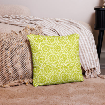 18″×18″ throw pillow with the 'Hendecagon' yellow-green geometric pattern in a cozy floor setting