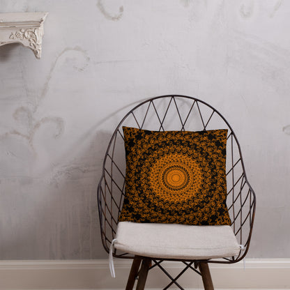 18″×18″ throw pillow with the 'The Sun' orange and black geometric design on a chair.