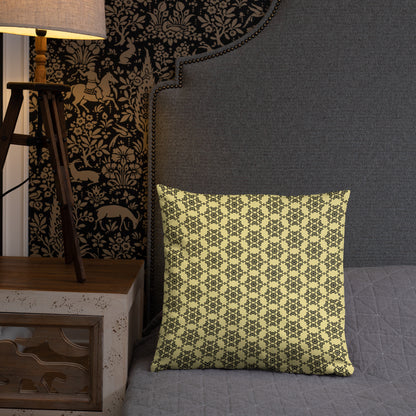18″×18″ throw pillow with the 'Hexagon' yellow and black geometric pattern on a bed.