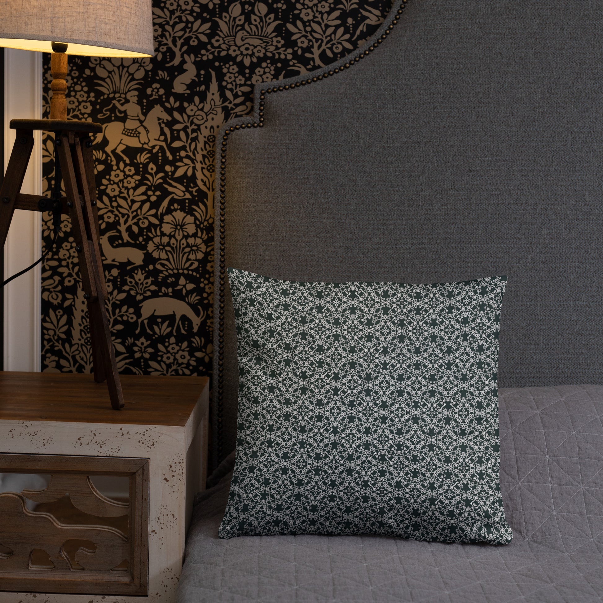 18″×18″ throw pillow with the 'Tetragon' charcoal and white geometric pattern on a bed.