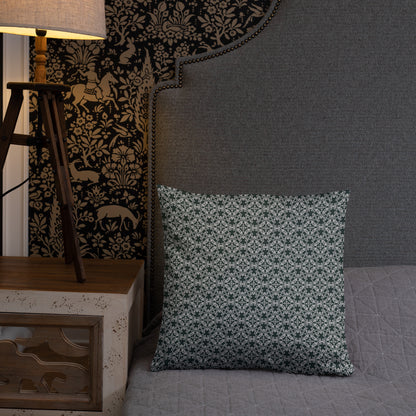 18″×18″ throw pillow with the 'Tetragon' charcoal and white geometric pattern on a bed.