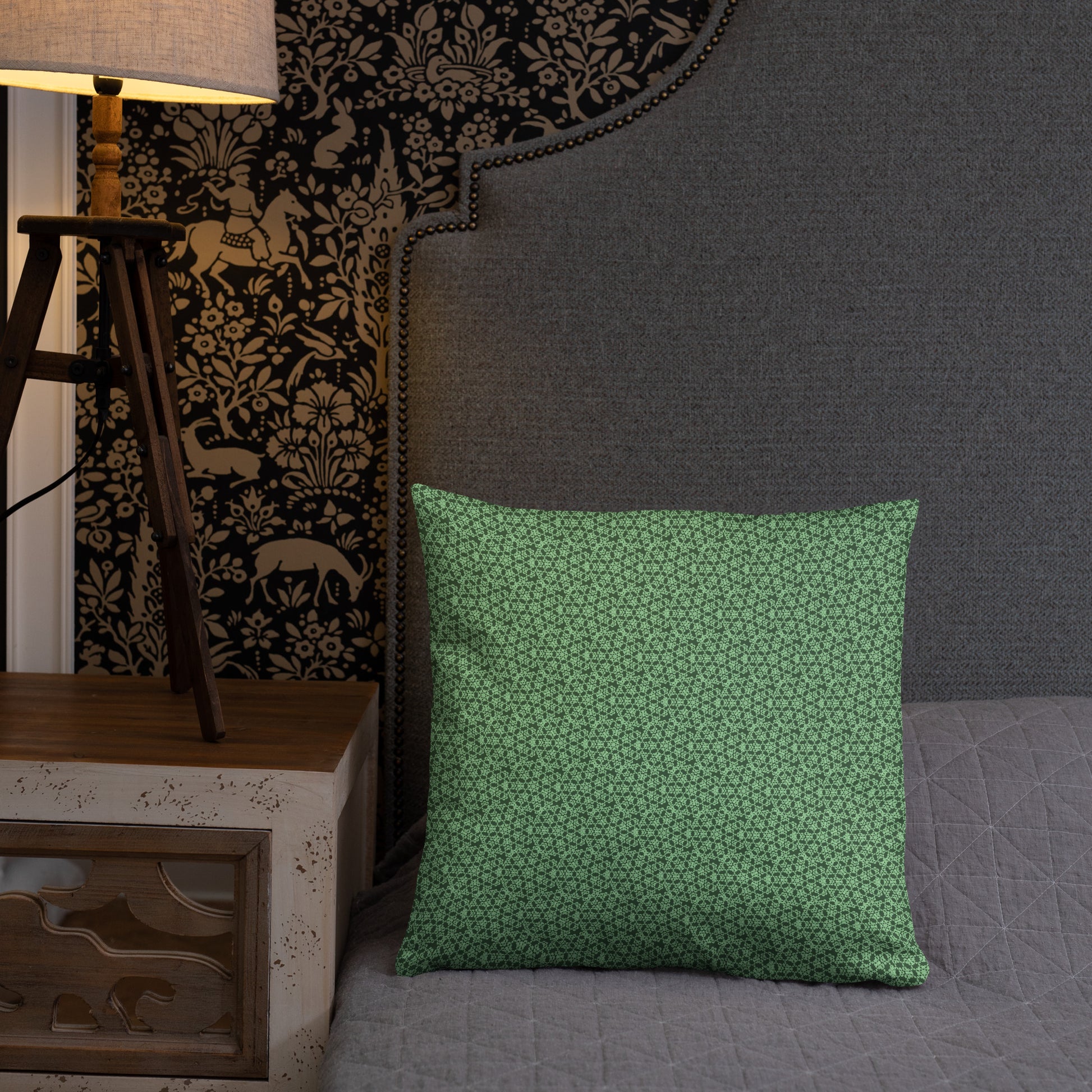 18″×18″ throw pillow with the 'Heptagon' green geometric pattern on a bed.