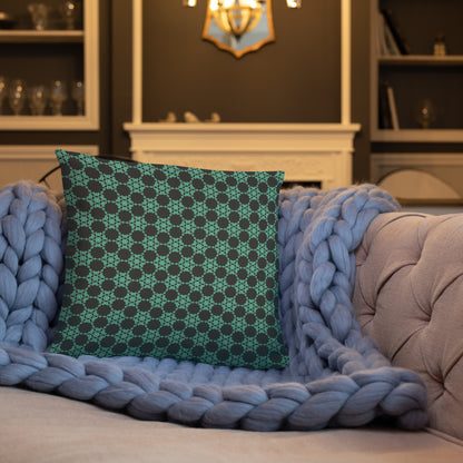 18″×18″ throw pillow with the 'Flowers Victory' charcoal and mint geometric pattern on a sofa.