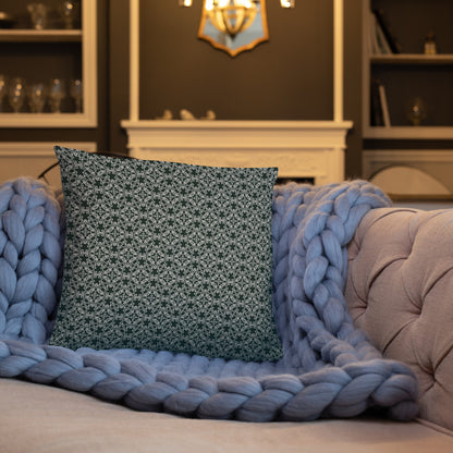 18″×18″ throw pillow with the 'Tetragon' charcoal and white geometric pattern on a sofa.