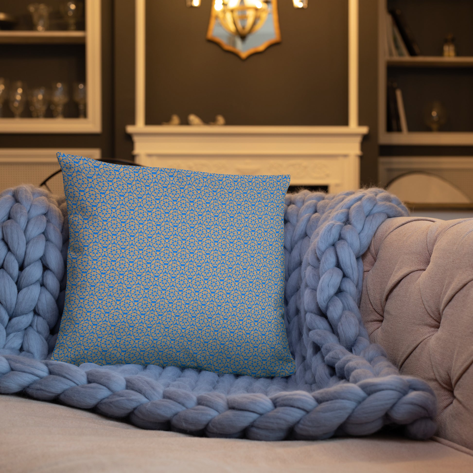 18″×18″ throw pillow with the 'Pentagon' blue and yellow geometric pattern on a sofa.