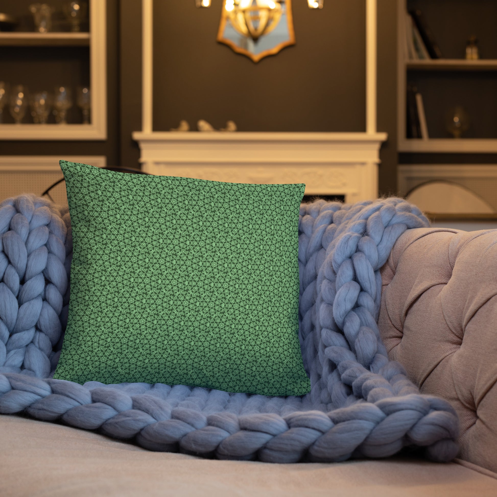 18″×18″ throw pillow with the 'Heptagon' green geometric pattern on a sofa.