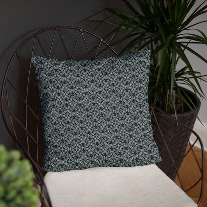 Front of the 18″×18″ basic pillow with the 'Quadragon' charcoal and white fractal geometric pattern on a chair.