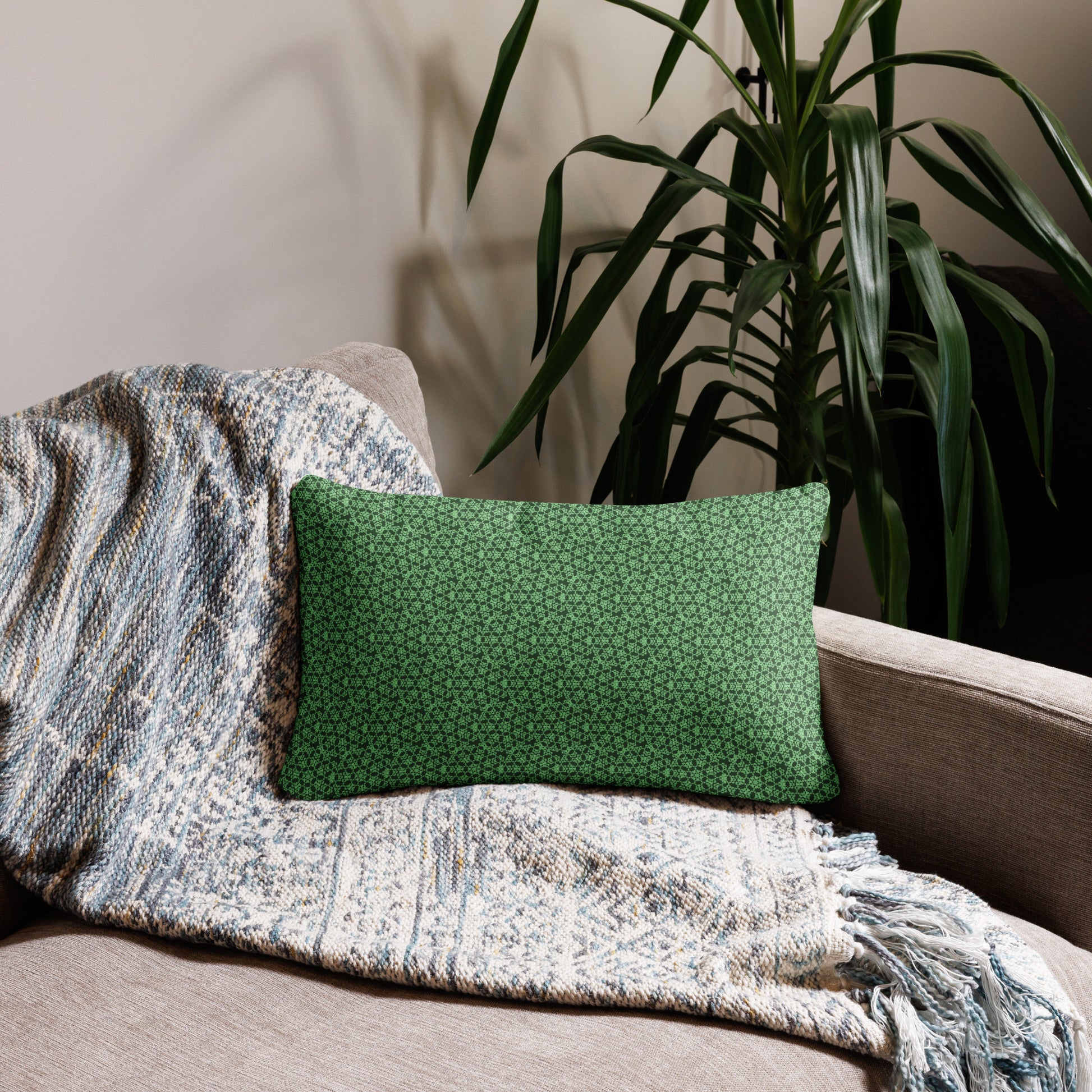 20″×12″ throw pillow with the 'Heptagon' green geometric pattern on a couch.