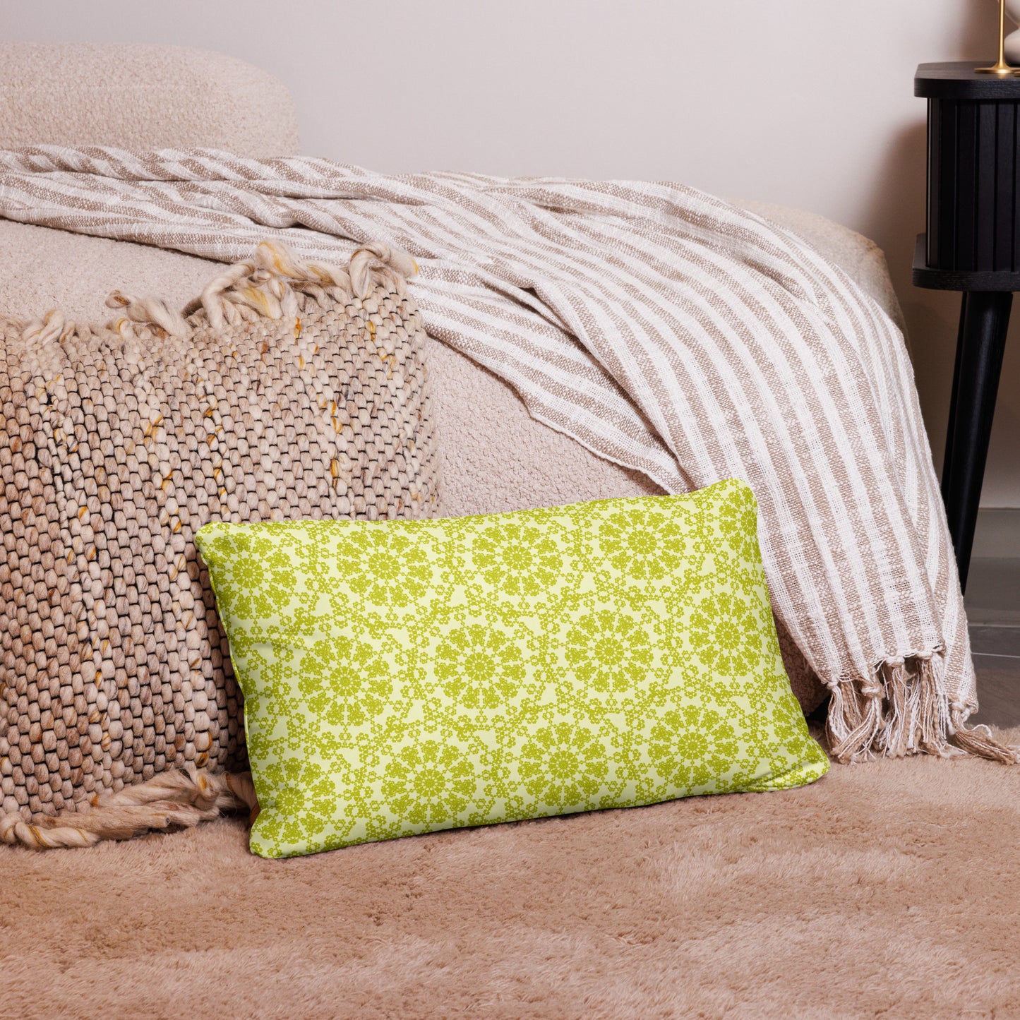 20″×12″ throw pillow with the 'Hendecagon' yellow-green geometric pattern in a cozy floor setting
