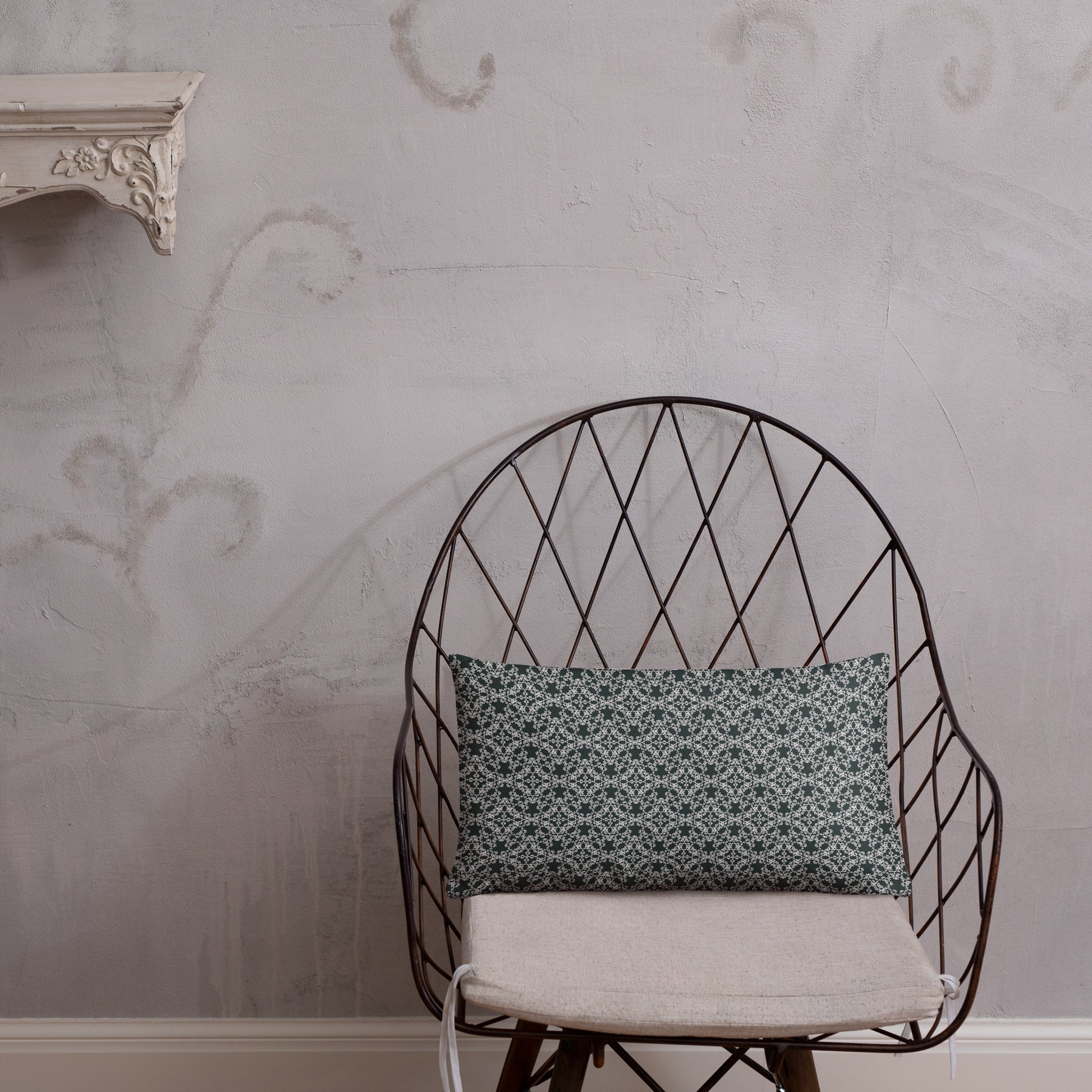 20″×12″ throw pillow with the 'Tetragon' charcoal and white geometric pattern on a chair.
