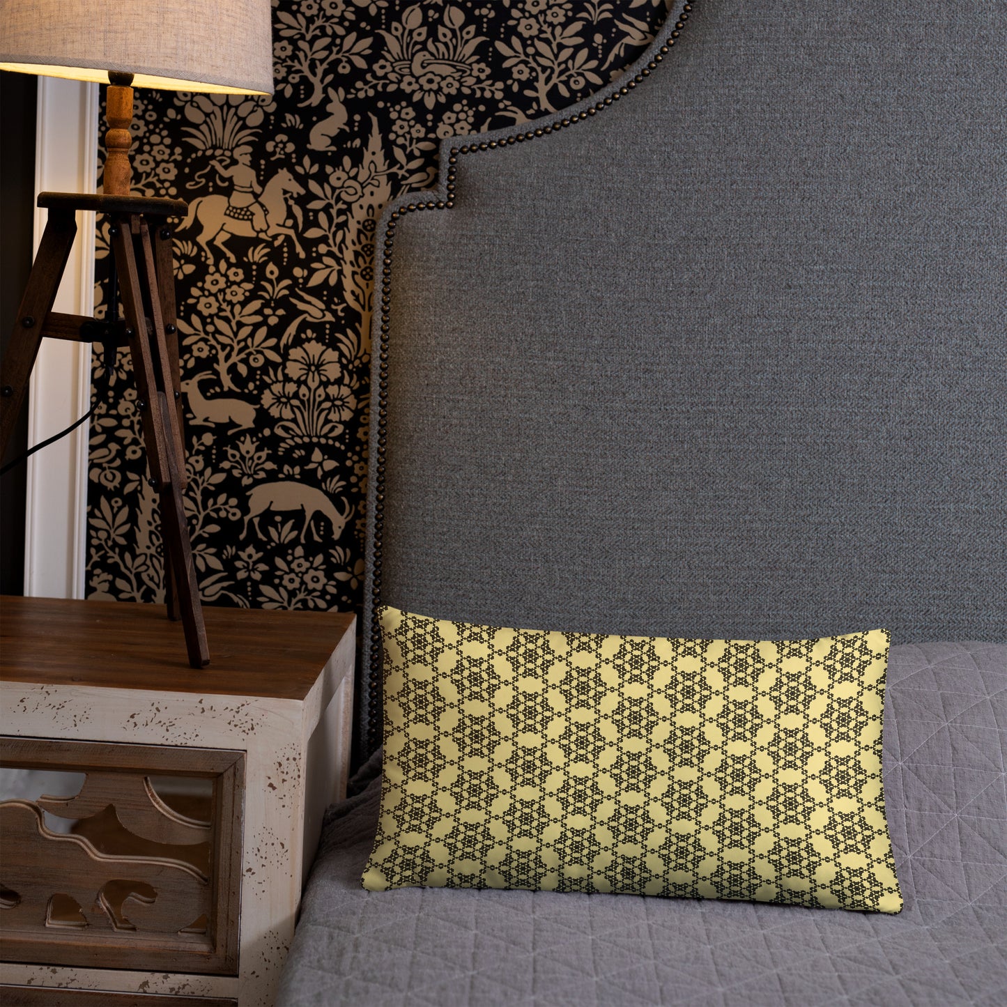 20″×12″ throw pillow with the 'Hexagon' yellow and black geometric pattern on a bed.