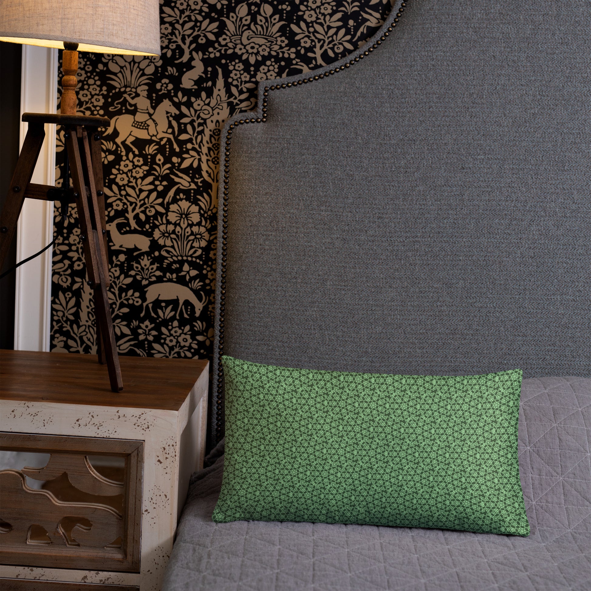 20″×12″ throw pillow with the 'Heptagon' green geometric pattern on a bed.