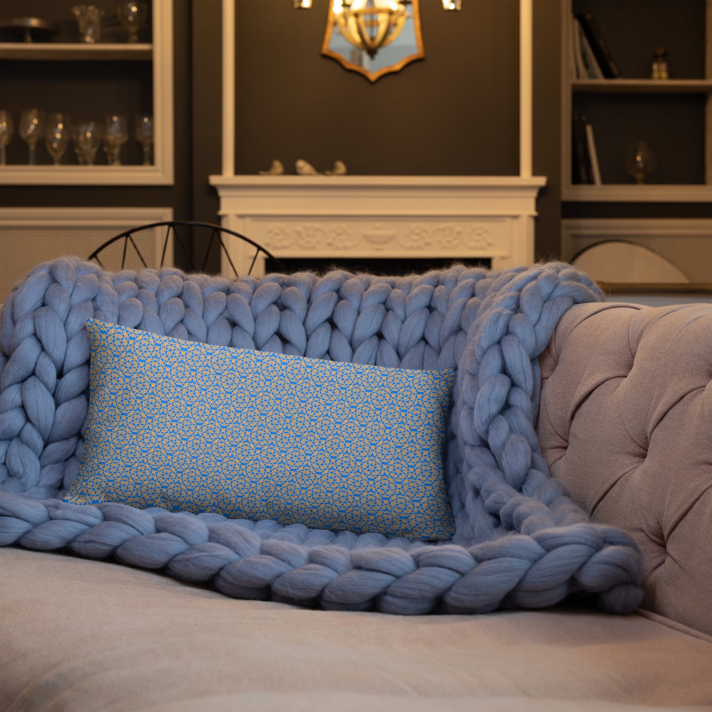20″×12″ throw pillow with the 'Pentagon' blue and yellow geometric pattern on a sofa.