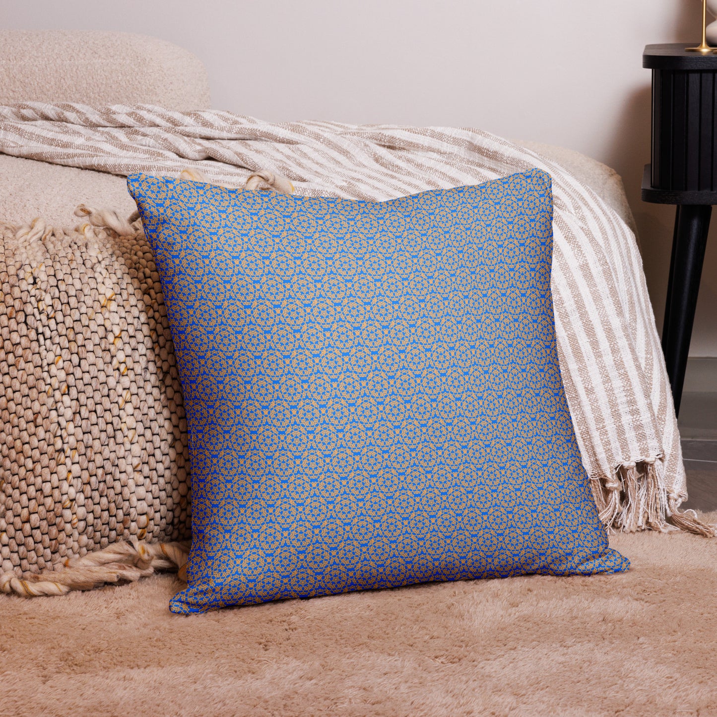 22″×22″ throw pillow with the 'Pentagon' blue and yellow geometric pattern on a couch.
