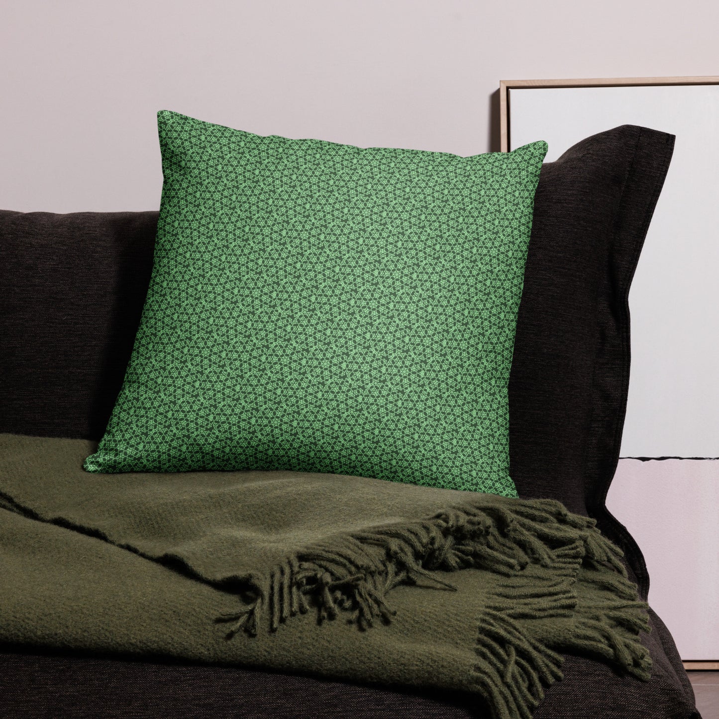 22″×22″ throw pillow with the 'Heptagon' green geometric pattern on a couch.