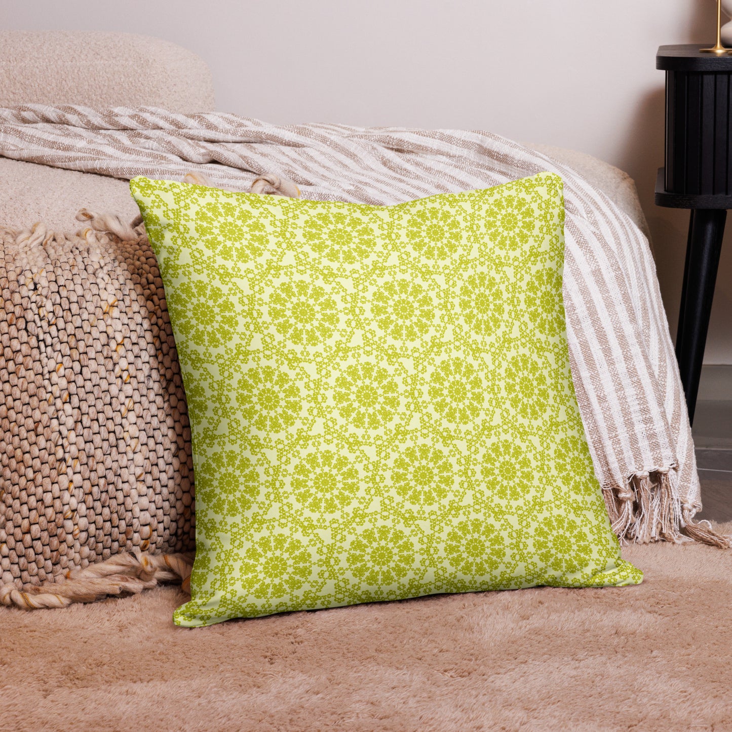 22″×22″ throw pillow with the 'Hendecagon' yellow-green geometric pattern in a cozy floor setting
