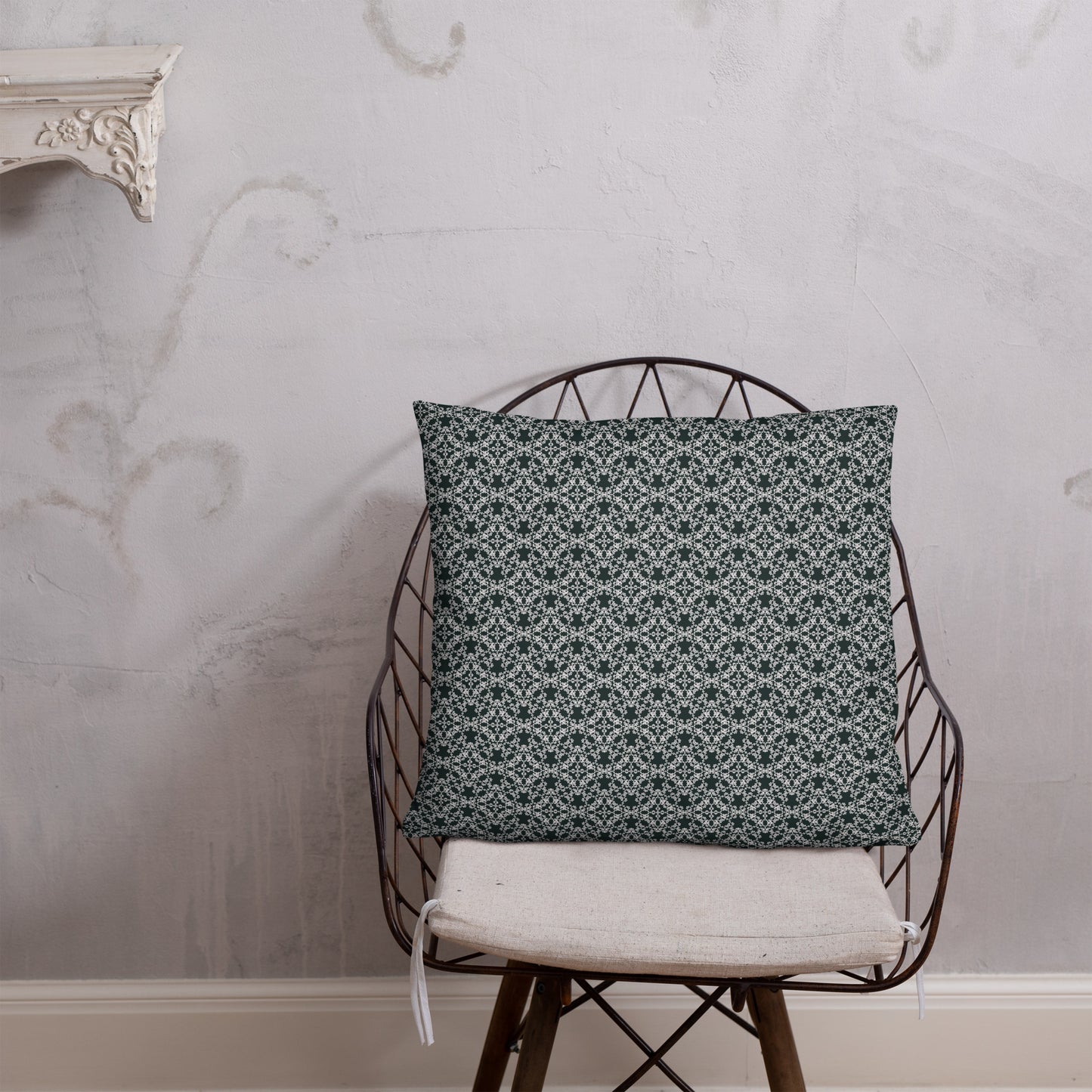 22″×22″ throw pillow with the 'Tetragon' charcoal and white geometric pattern on a chair.