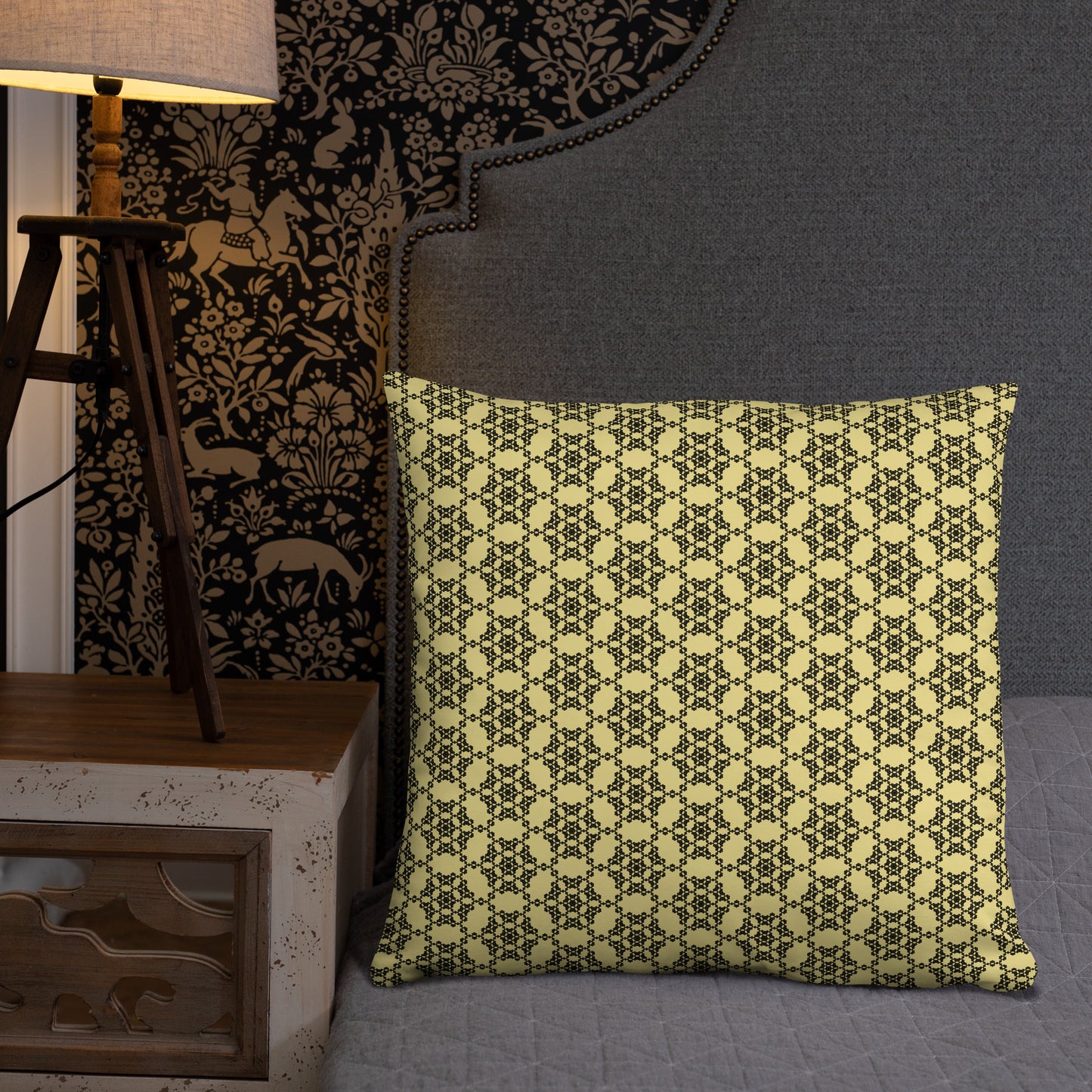 22″×22″ throw pillow with the 'Hexagon' yellow and black geometric pattern on a bed.