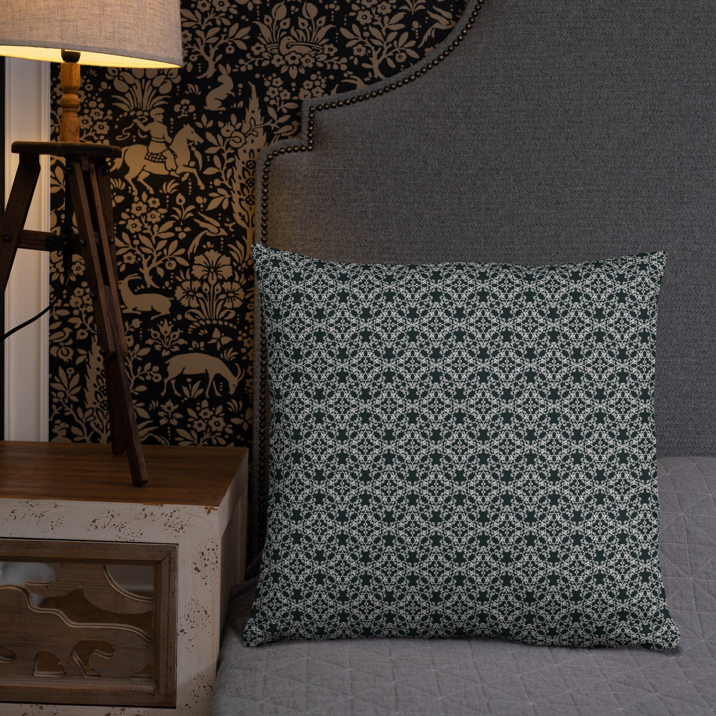 22″×22″ throw pillow with the 'Tetragon' charcoal and white geometric pattern on a bed.