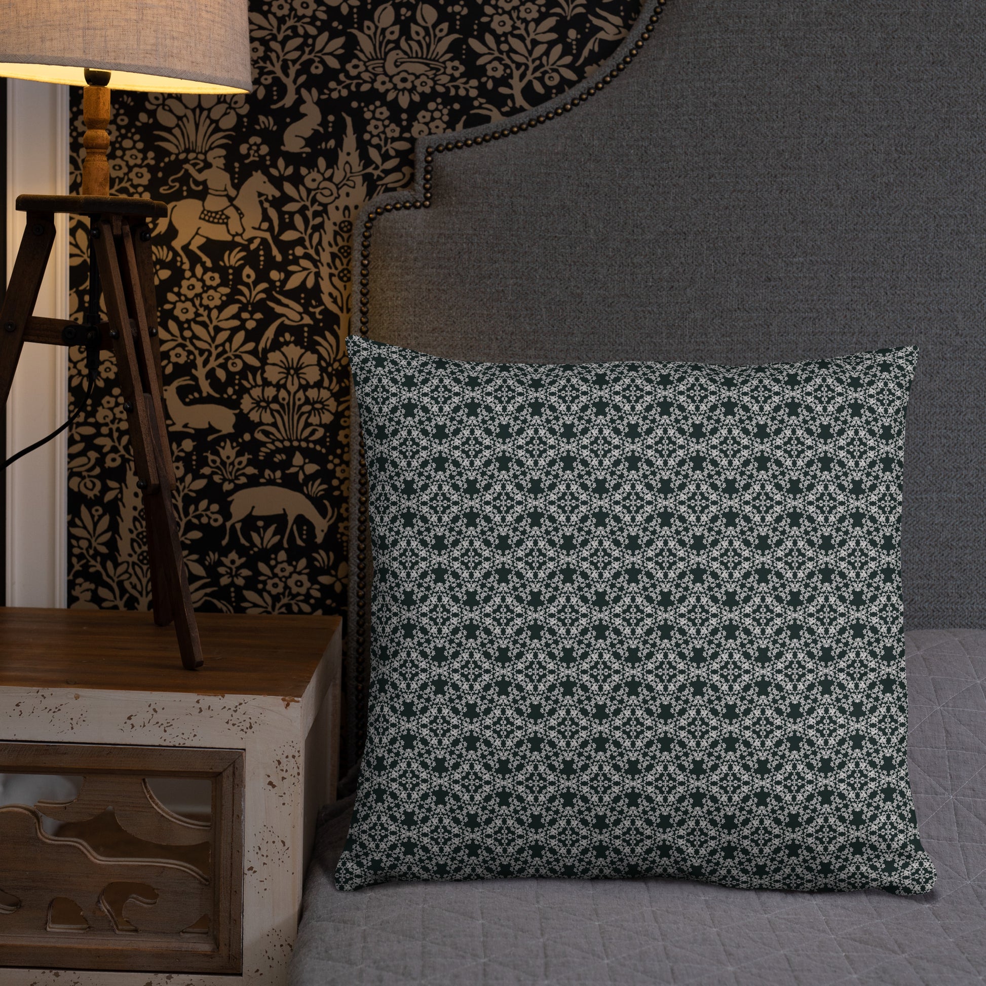 22″×22″ throw pillow with the 'Tetragon' charcoal and white geometric pattern on a bed.