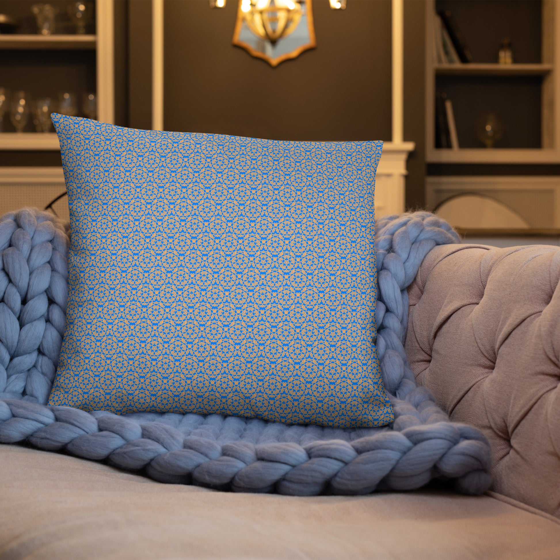22″×22″ throw pillow with the 'Pentagon' blue and yellow geometric pattern on a sofa.