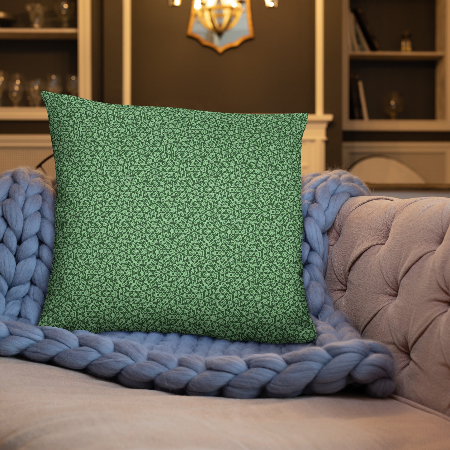 22″×22″ throw pillow with the 'Heptagon' green geometric pattern on a sofa.