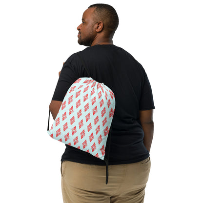 Back shot of the drawstring bag with the 'Digon' sky blue and red fractal geometric pattern slung over a man's shoulder.