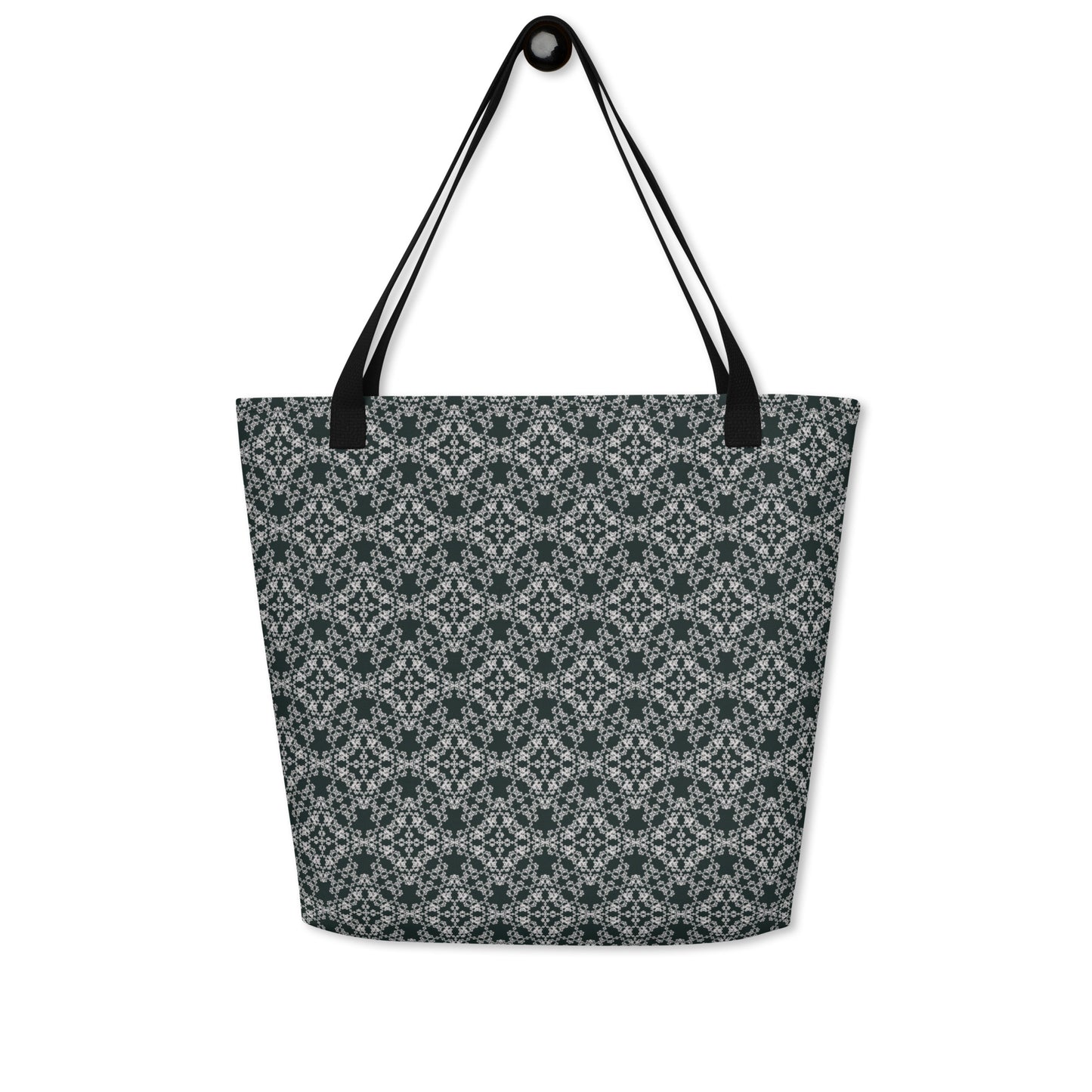 Hung large tote bag with the 'Quadragon' charcoal and white fractal geometric pattern.