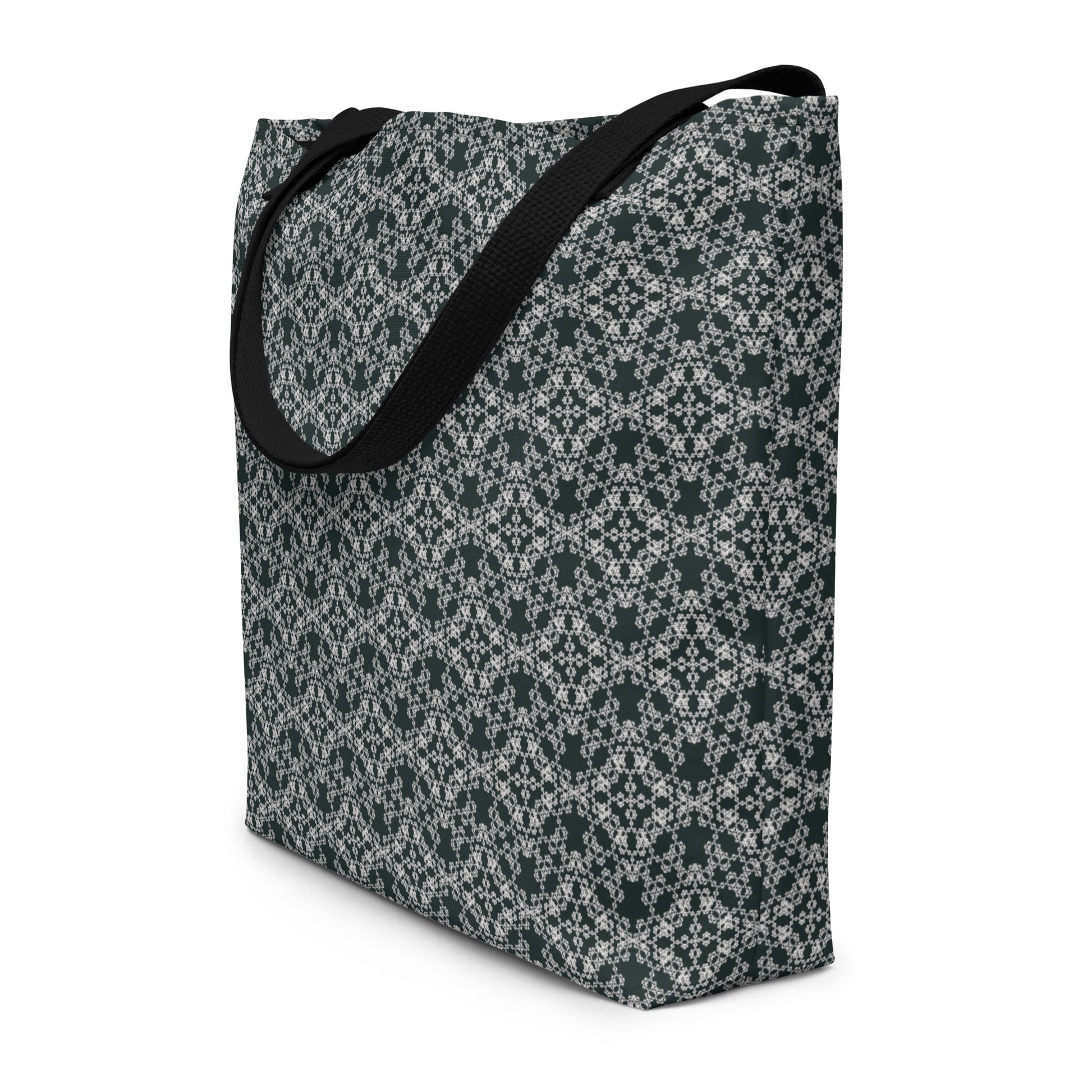 Angle shot of the large tote bag with the 'Quadragon' charcoal and white fractal geometric pattern.