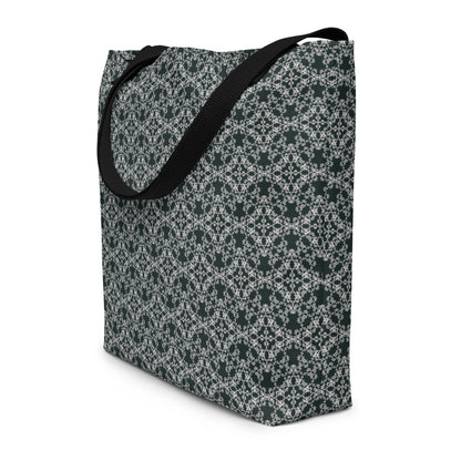 Angle shot of the large tote bag with the 'Quadragon' charcoal and white fractal geometric pattern.