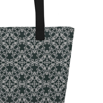Close up of the strap stitching of the large tote bag with the 'Quadragon' charcoal and white fractal geometric pattern.