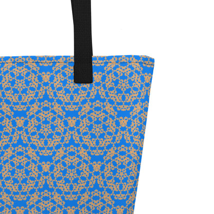 Close up of the strap stitching of the large tote bag with the 'Pentagon' blue and yellow fractal geometric pattern.