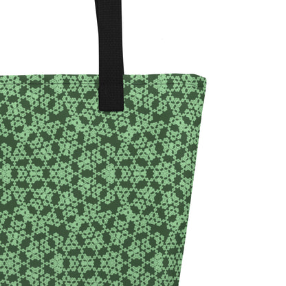 Close up of the strap stitching of the large tote bag with the 'Heptagon' green fractal geometric pattern.