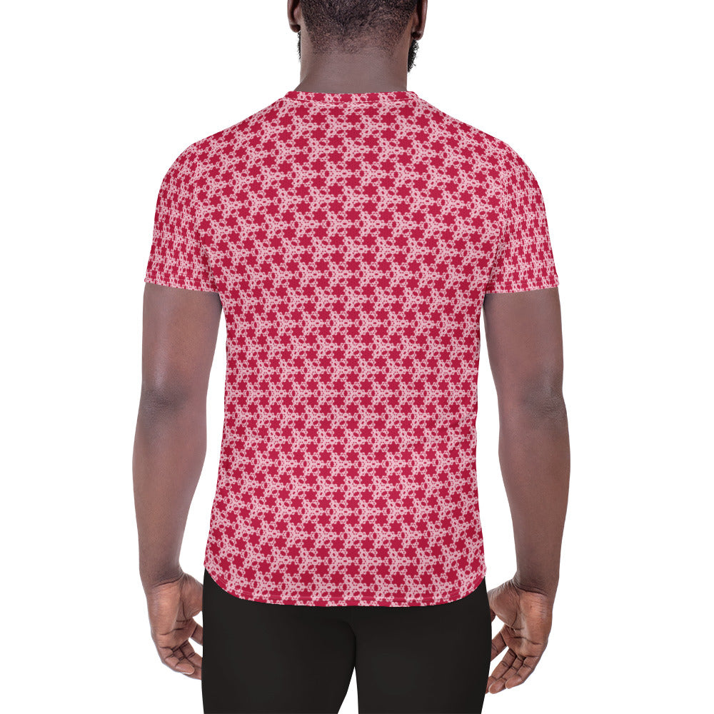 Back shot of a model wearing the men's athletic t-shirt with the 'Trigon' red and pink fractal geometric pattern.