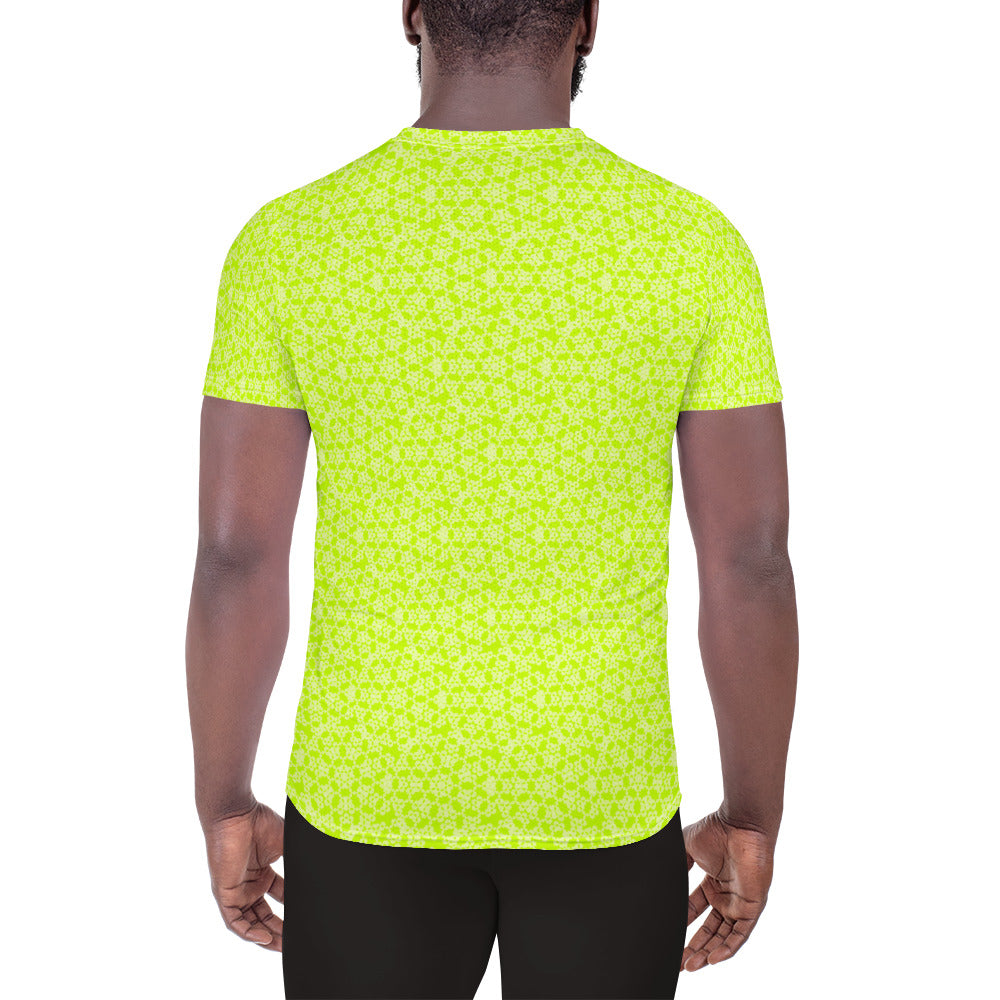 Back shot of a model wearing the men's athletic t-shirt with the 'Heptagon' yellow-green fractal geometric pattern.