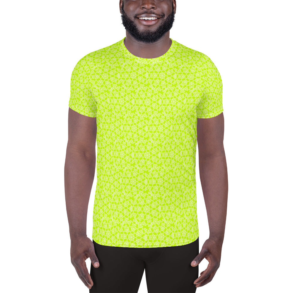Front shot of a model wearing the men's athletic t-shirt with the 'Heptagon' yellow-green fractal geometric pattern.
