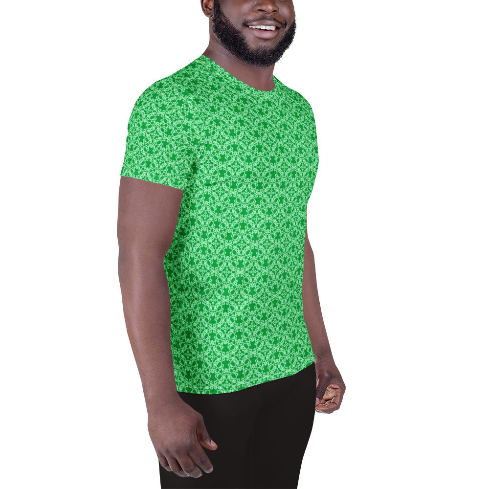 Right front shot of a model wearing the men's athletic t-shirt with the 'Tetragon' green fractal geometric pattern.