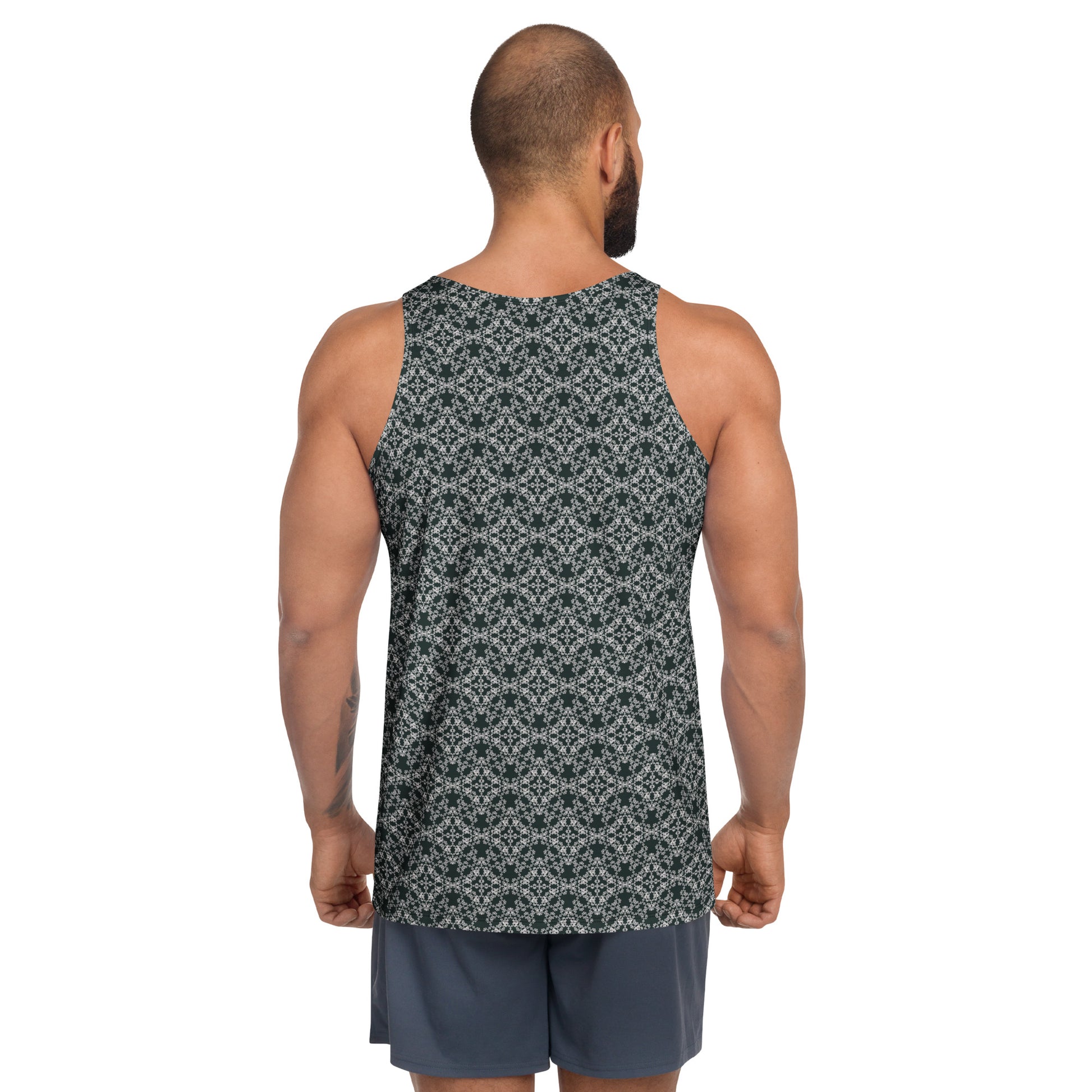 Back shot of a model wearing the men's tank top with the 'Quadragon' charcoal and white fractal geometric pattern.