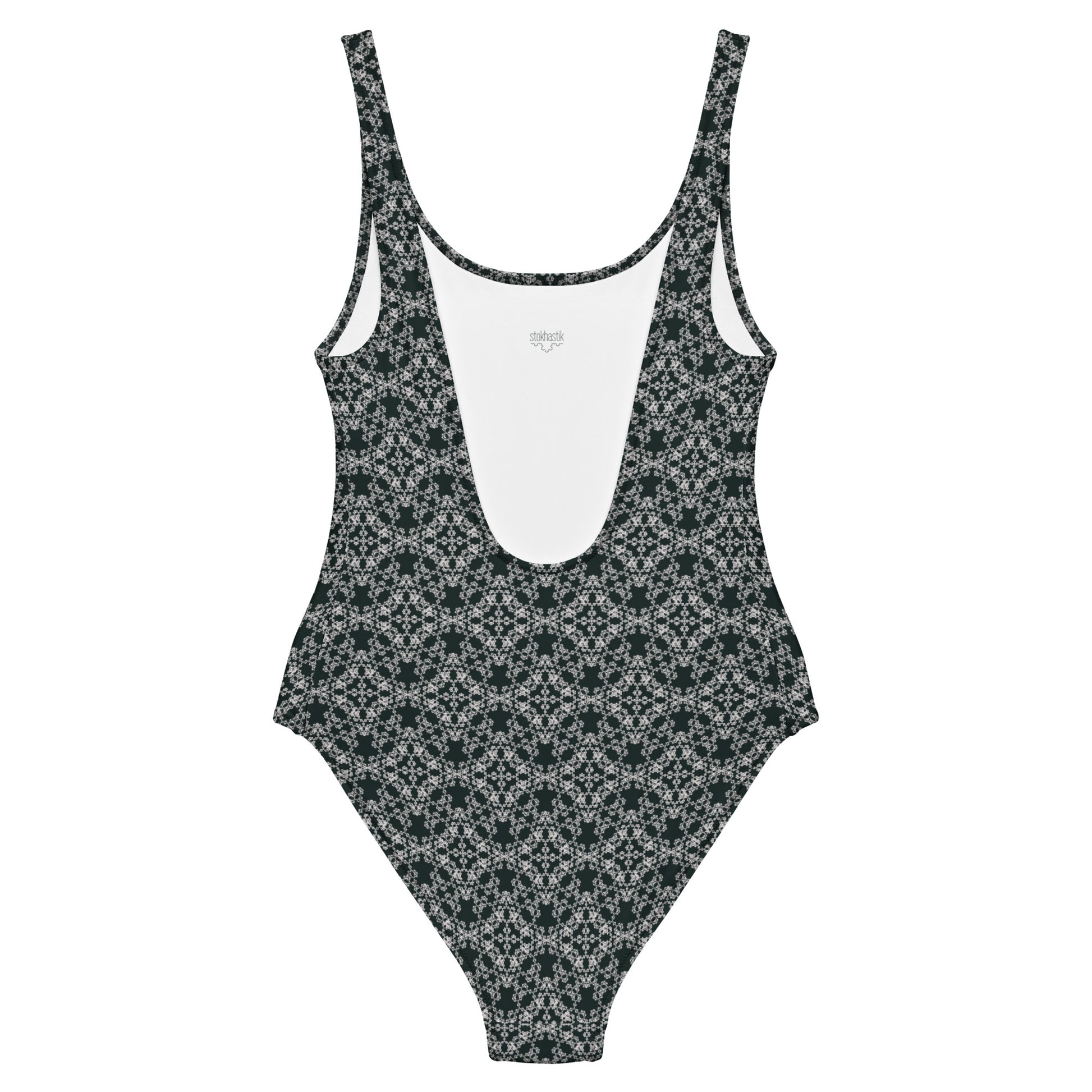 Back of the one-piece swimsuit with the 'Quadragon' charcoal and white fractal geometric pattern.